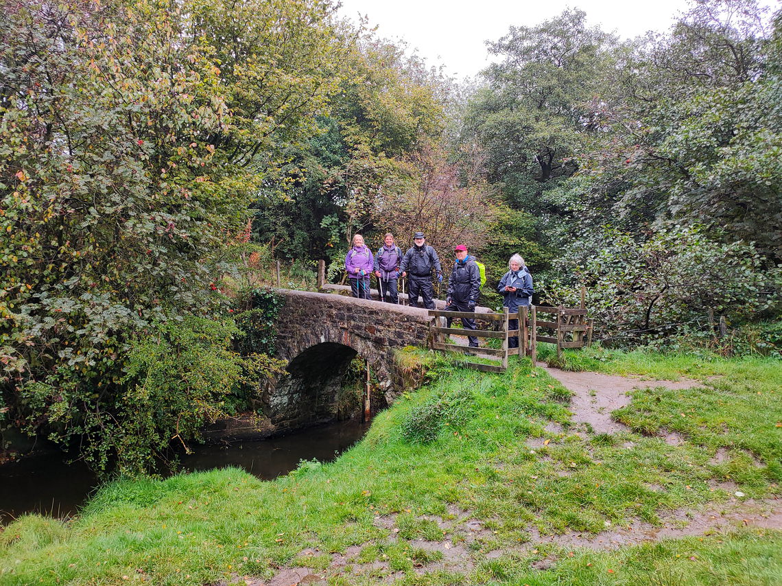The elite team assembled on the footbridge to Hollins Hill.